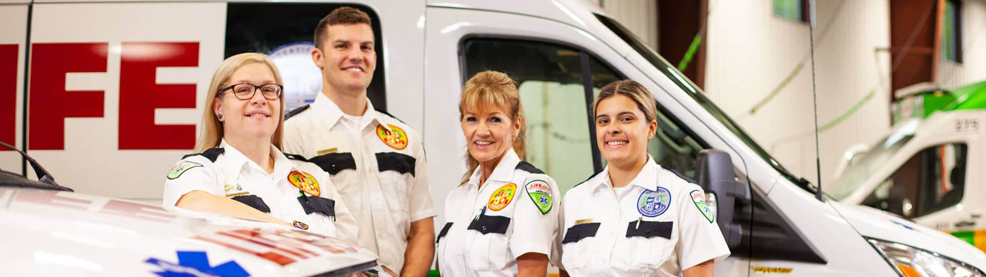 life-ems-team-members-next-to-fleet_540px Life EMS team members next to fleet