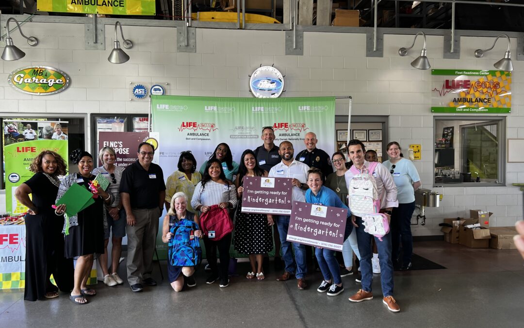 Volunteers fill backpacks at EMS center for young kids (SEP. 2021)