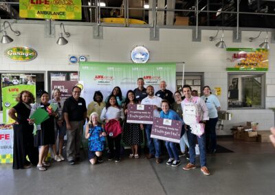 Volunteers fill backpacks at EMS center for young kids (SEP. 2021)