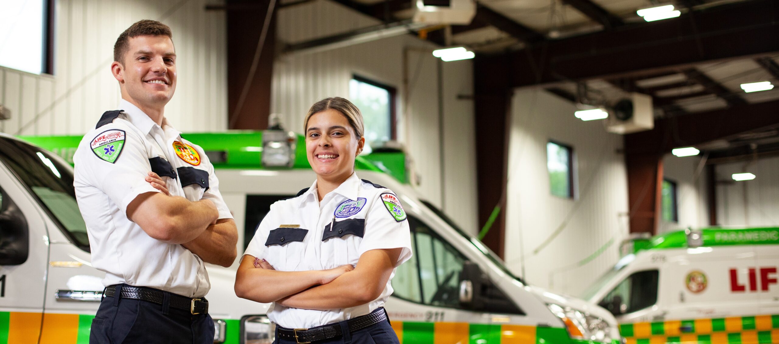 Life EMS team members next to fleet